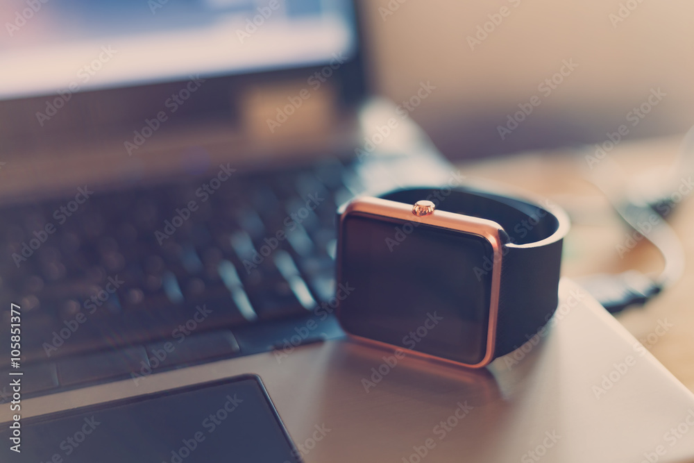 Watch Like Computer Smartwatches on laptop computer. Smart wrist watches with empty screen ...