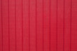Worn rustic red barn board paneling texture