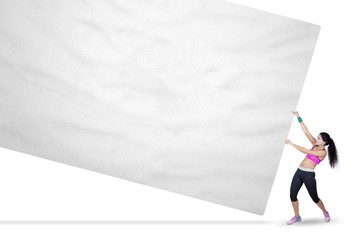 fitness woman pulling empty banner