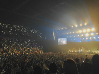 Blurred background : Bokeh lighting in indoor concert with cheering audience