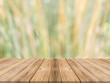 © tirachard - Wooden board empty table in front of blurred background. Perspective brown wood over blur trees in forest - can be used mock up for display or montage your products. spring season. vintage filtered.
