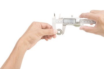 Hands holding Vernier caliper and measuring bearing on white bac