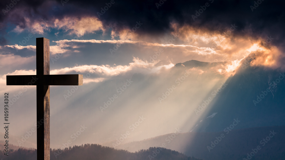 Jesus Christ cross. Easter, resurrection concept. Christian cross on a background with dramatic lighting, colorful mountain sunset, dark clouds and sky and sunbeams  - obrazy, fototapety, plakaty 
