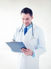 Poster - male doctor writing prescription