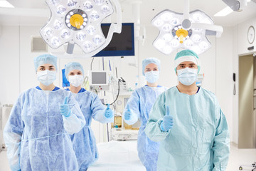 Wall Mural - group of surgeons in operating room at hospital