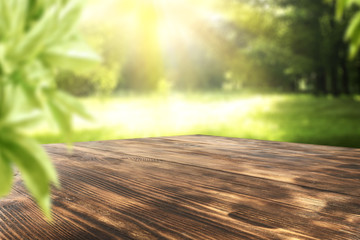 Poster - wooden desk and garden space 