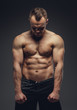 © Fxquadro - Awesome muscular guy showing his body.
