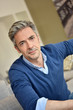 © goodluz - Portrait of smiling handsome man with grey hair
