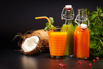 Wall Mural - Glasses with fresh vegetable juices isolated on black. Detox 