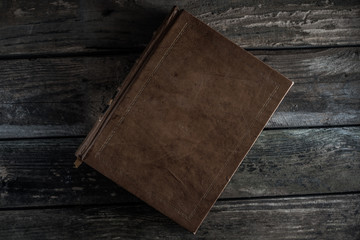 old book on wooden table