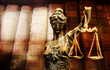 Bronze statuette of justice. Digitally assembled with blurry backround. Focus on face.