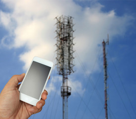 Wall Mural - hand holding the smartphone on blurred telecommunication radio a