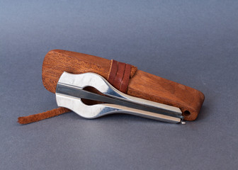 Jew's harp with wooden case on grey background