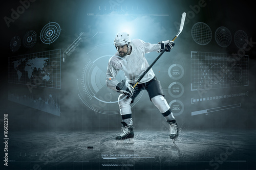 Fototapeta na szkło Ice hockey player on the ice around modern light