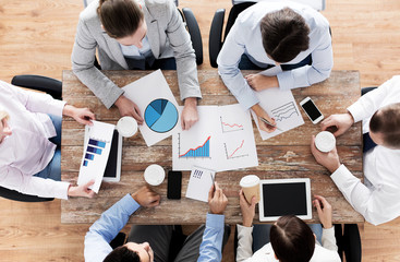 Sticker - close up of business team with coffee and papers