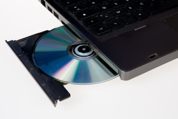 close up image of a computer and cd and dvd