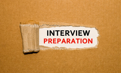 Wall Mural - The text Interview Preparation appearing behind torn brown paper