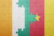 © luzitanija - puzzle with the national flag of cote divoire and cameroon