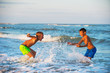 © Valua Vitaly - Two boys playing at the beach with water. Big splashes