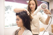 © Monet - Beautician is dry the hair of women