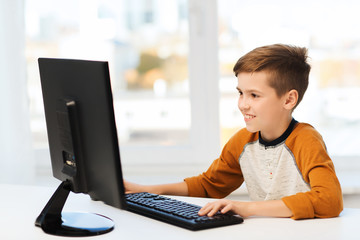 Canvas Print - smiling boy with computer at home