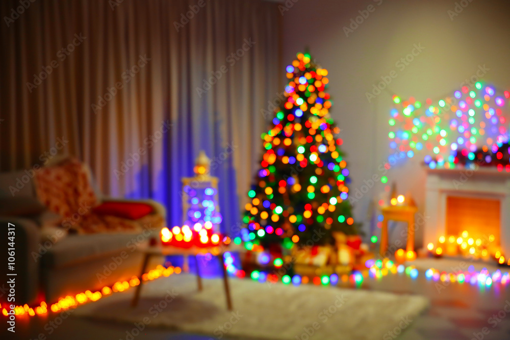 Christmas tree near fireplace and other decor in the room