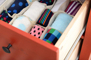 Wall Mural - Folded clothes in chest of drawers closeup