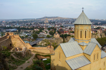 St. Nicholas Church in the fortress Narikala, panoramic city views of St. George's Bridge of Peace and Sameba, Tbilisi.