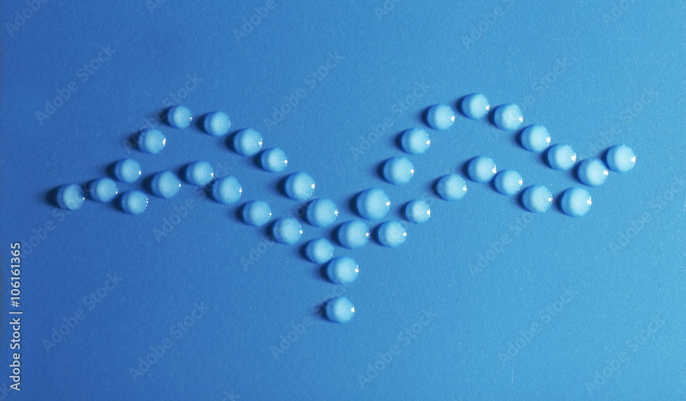 Bird made of water drops on blue background