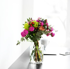 Wall Mural - Bouquet of flowers in jar on the table