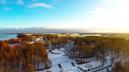 Wall Mural - Winter landscape. Aerial footage. Sunset. River and sea coast.