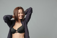Smiling woman in bra
