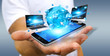 © sdecoret - Businessman connecting tech devices