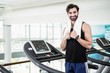© WavebreakmediaMicro - Smiling man standing on treadmill