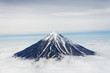 Volcanic mountains above the clouds