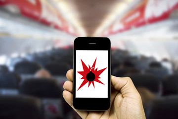 people holding smart phone on blurred cabin crew airplane background