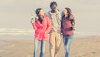 © Davide Angelini - Group of multiracial people smiling outdoor