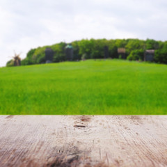 Poster - Wooden table on blurred nature background