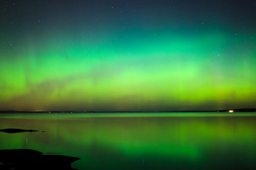 Wall Mural - northern lights over lake in finland