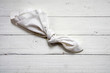 reminder, knot in an old  handkerchief on white painted wood