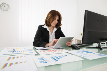 Wall Mural - Businesswoman Working On Digital Tablet