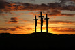 Three crosses over bright sunset with copy space