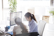 © Monet - Company employee is talking happily with a colleague next to the seat