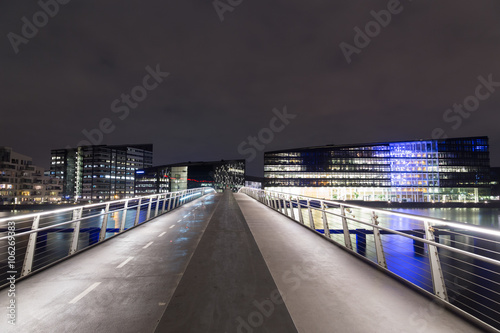 Modern cyclist and pedestrian bridge Bryggybroen in Copenhagen by night Poster