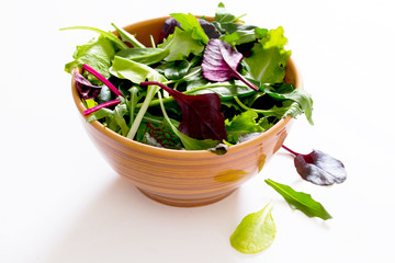 mix salad arugula, spinach, chard, oak salad in ceramic cup on a