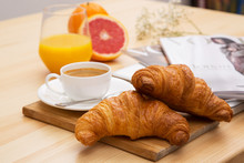 Delicious Croissant With A Cup Of Coffee And A Glass Of Orange J