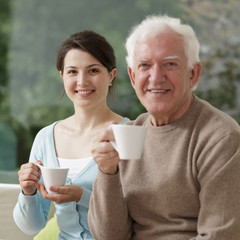 Wall Mural - Granddaughter and grandfather sitting