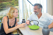 © auremar - Man and lady enjoying a hot drink together