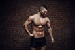 © honored - Young muscular man posing