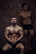 © honored - Two young muscular men